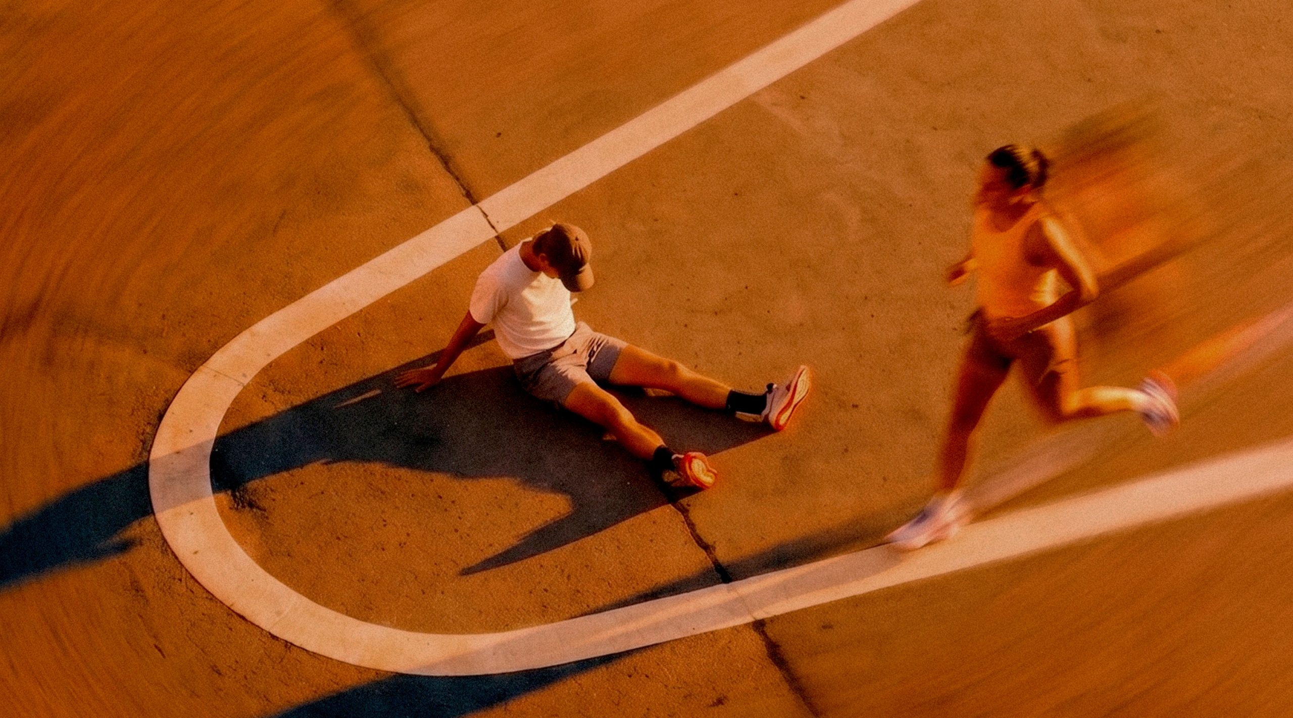 Athlete running through a city street at golden hour